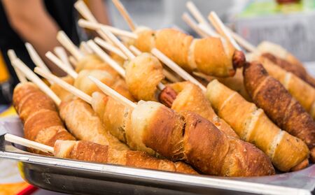 Traditional South Korean corn dogs at a street food marketの写真素材