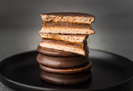 Alfajor with dulce de leche cake, Argentine dessert with chocolate and caramelの写真素材