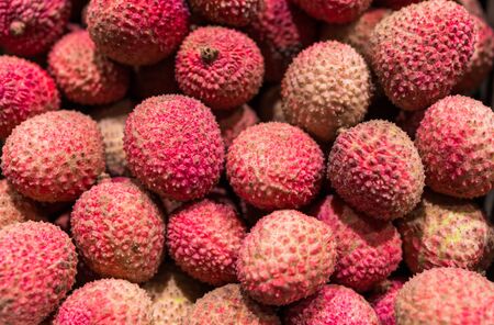 Close up food photo of organic lychee exotic fruit at the farmers market stallの写真素材