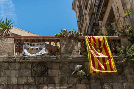 Barcelona, Spain - August 1, 2019: Cataloni flag and sign of political prisonersのeditorial素材