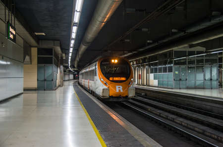 Barcelona, Spain - August 3, 2019: Local train at Barcelona Sants stationのeditorial素材