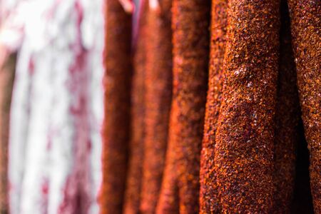 Selection of traditional colorful Italian delicatessen salami sausage.の写真素材
