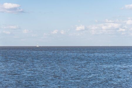 Scenic view at blue turquoise transparent water surface with boats.の写真素材