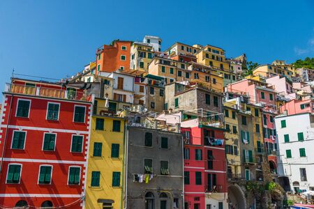 Colorful Italian architecture houses in Riomaggiore village, Cinque Terre.
