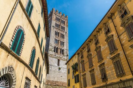 Narrow streets of Lucca ancient town with traditional architecture, Italy.の写真素材