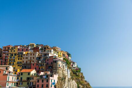 Manarola village in Cinque Terre, Italy, with its traditional colorful houses.の写真素材