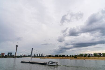 View at Rhine river, Rheinthurm tower, and Medienhafen district in Dusseldorf.の写真素材