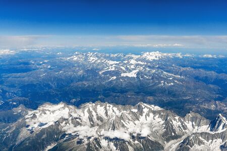 Landscape aerial view of Alps mountains with clouds and fog above Switzerland.の写真素材