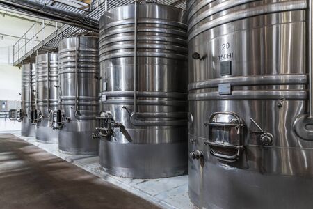 Steel wine tanks for wine fermentation at a winery.の写真素材