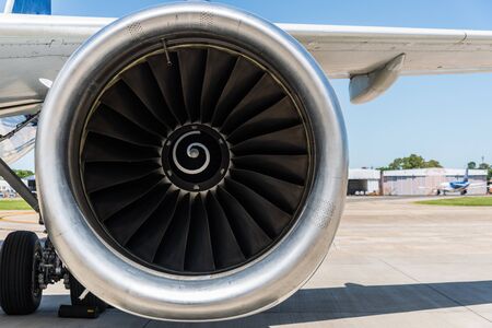 Engine and a wing of an aircraft plane at the airport.の写真素材