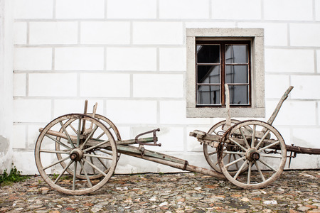Vintage Old Wooden Ploughe with Renaissance Sgrafito Wall on Background Photoの写真素材
