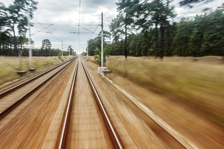 Back Door Train View. Landscape in Motion with Train Rails.の写真素材