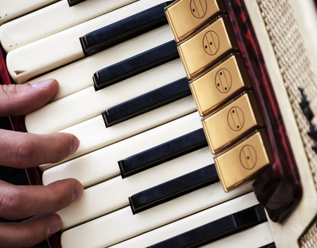 Fingers Playing Accordion Keys. Retro Photo.の写真素材