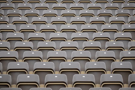 Rows of empty seats outdoors - background for designs
