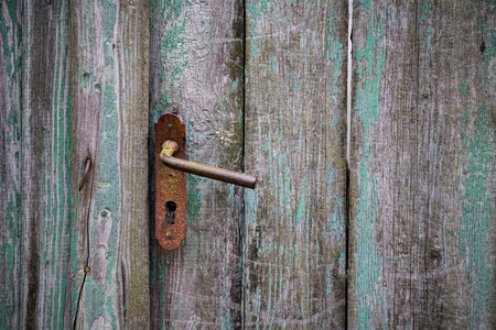 Vintage wooden doors with rusty handlesの写真素材