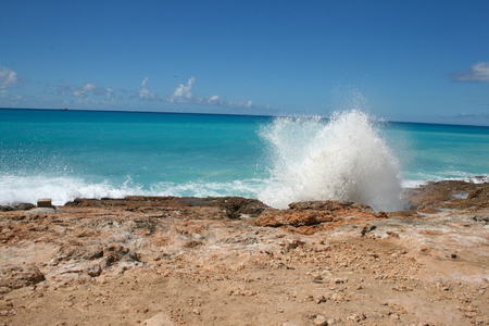 Waves crashing on the shoreline of St Martinの写真素材