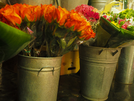 Orange Tulips are blooming and for sale in Flower Shopの写真素材