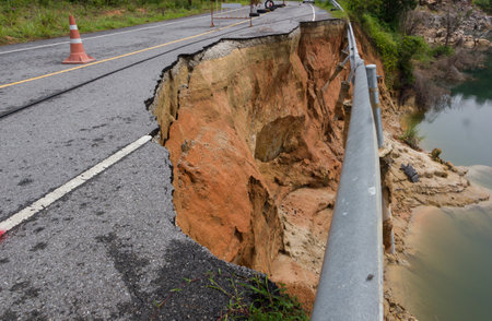 Road closure due to flooded road in rural area.の写真素材