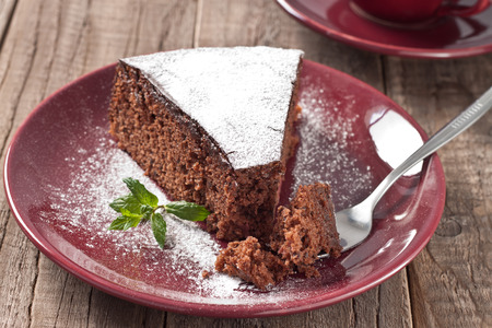 A piece of chocolate cake with crumbsの写真素材
