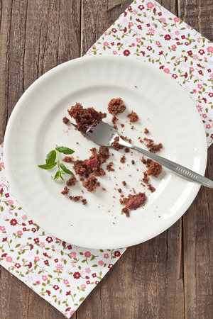Crumbs of an eaten chocolate cakeの写真素材