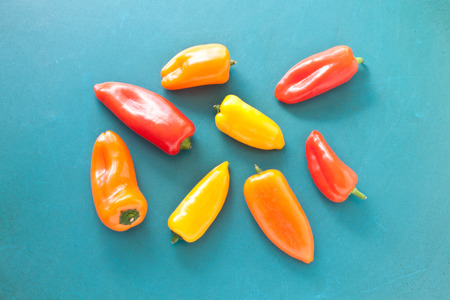 Colorful mini paprika on a turquoise backgroundの写真素材