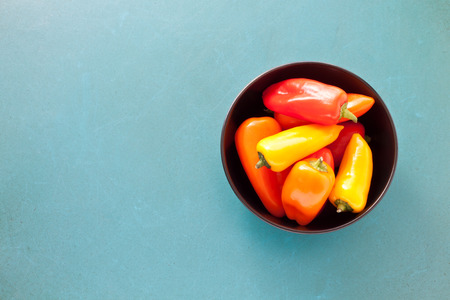 Colorful mini paprika on a turquoise backgroundの写真素材