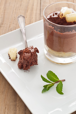 Eating homemade Chocolate Mousse with pineappleの写真素材