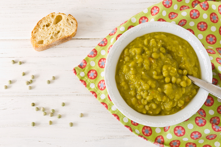 Fresh homemade pea soup with breadの写真素材