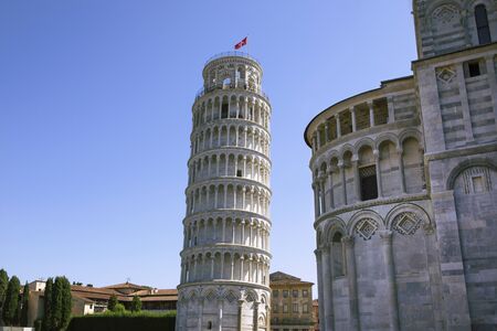 Leaning Tower of Pisa with part of Cathedral of st Mary and surrounding buildings on the square....