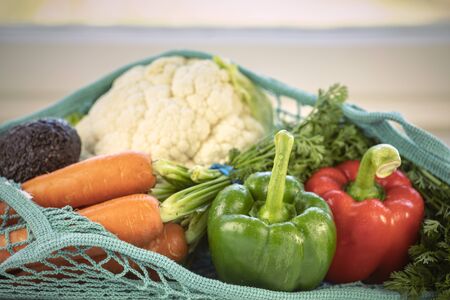 Close up of fresh produce in a blue fishnet knittedの写真素材