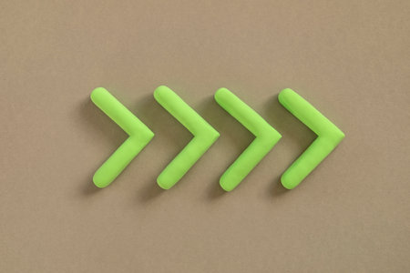 Green arrows pointing right side. Three dimensional arrow sign showing direction on neutral...