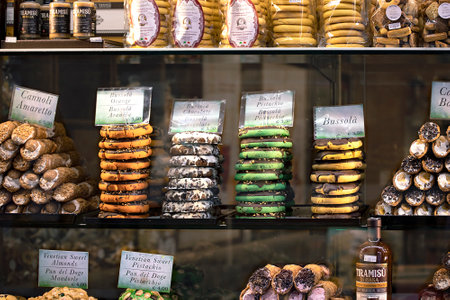 Venice, Italy, 05.26.2022: Italian Pastries and cookies on display of Confectionery Shop Stock...