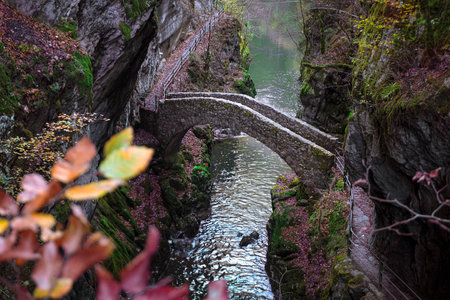 Gorges de l'Areuse, Noiraigue, Neuchatel, Switzerland, Europe. Romantic stone bridge over the river...