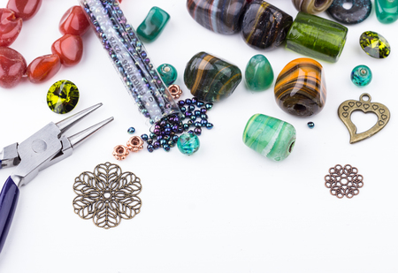 Stone beads, crystals, glass beads, metal components and seedbeads for making jewelry. Selective focus.の写真素材