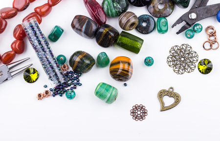 Semi-precious stone beads, crystals, glass beads, metal components and seedbeads for making jewelry. Selective focus.の写真素材