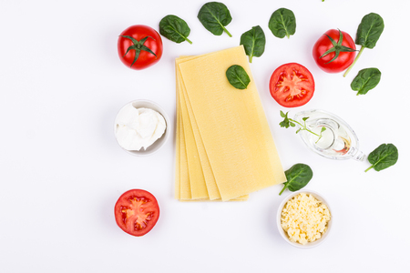 Ingredients for spinach lasagne on white background. Flat lay composition.の写真素材