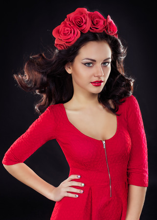 beautiful girl with a wreath on his head on black backgroundの写真素材