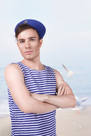 young handsome sailor in the background of the seaの写真素材