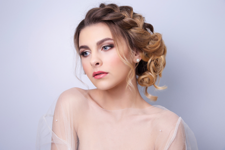 beautiful woman  bride with tiara on head  on bright background , copy space.の写真素材