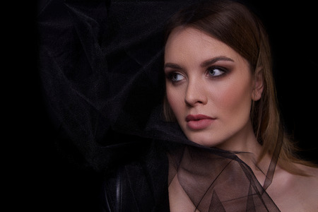 Beauty Fashion Model Woman , portrait. Concept Girl face with perfect skin in dark Background.の写真素材