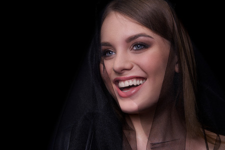 Beauty Fashion Model Woman , portrait. Concept Girl face with perfect skin in dark Background.の写真素材