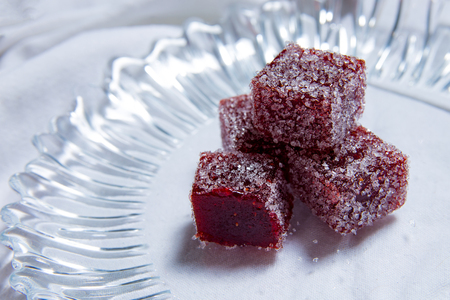 Closeup Homemade marmalade on plate. Handmade sweets on white textile background.の写真素材