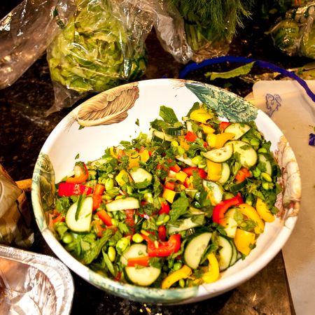 Greek salad is essentially a tomato salad made of sliced or chopped tomatoes with a few slices of cucumber, red onion, feta cheese, and kalamata olives, seasoned with salt, black pepper, oregano, and basil and dressed with olive oil.の写真素材