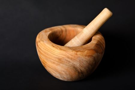 A mortar and pestle is a tool used to crush, grind, and mix substances. The pestle is a heavy stick whose end is used for pounding and grinding, and the mortar is a bowl.の写真素材