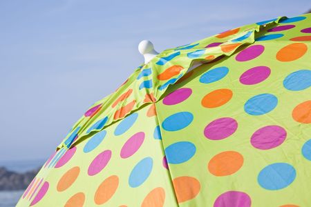 An umbrella or parasol (sometimes colloquially; gamp, brolly, umbrellery, or bumbershoot) is a canopy designed to protect against precipitation or sunlight.の写真素材