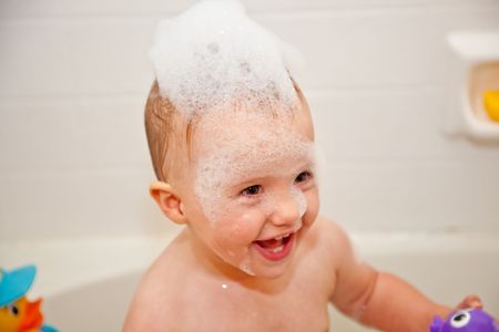 Bubbles on top of the water, less ambiguously known as a foam bath (see photo), can be obtained by adding a product containing foaming surfactants to water and temporarily aerating it by agitationの写真素材
