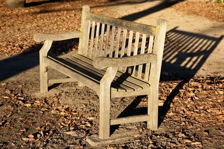 A bench is a piece of furniture, which mostly offers several persons seating.の写真素材
