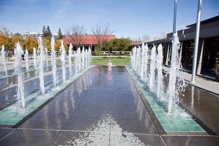 A fountain is a piece of architecture which pours water into a basin or jets it into the air either to supply drinking water or for decorative or dramatic effect.の写真素材