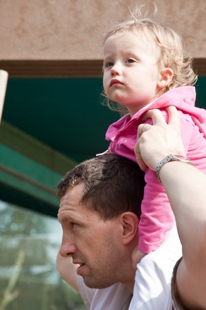 Father with little daughter exploring outdoors together.の写真素材