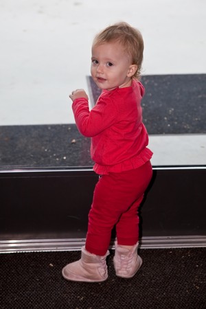 Cute caucasian toddler girl walking around and exploring.の写真素材